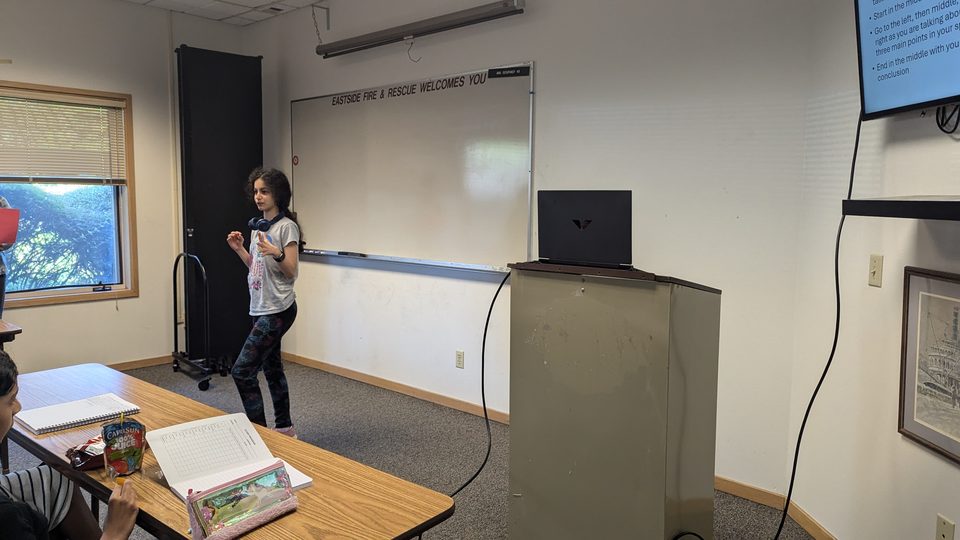 Students smiling at a workshop